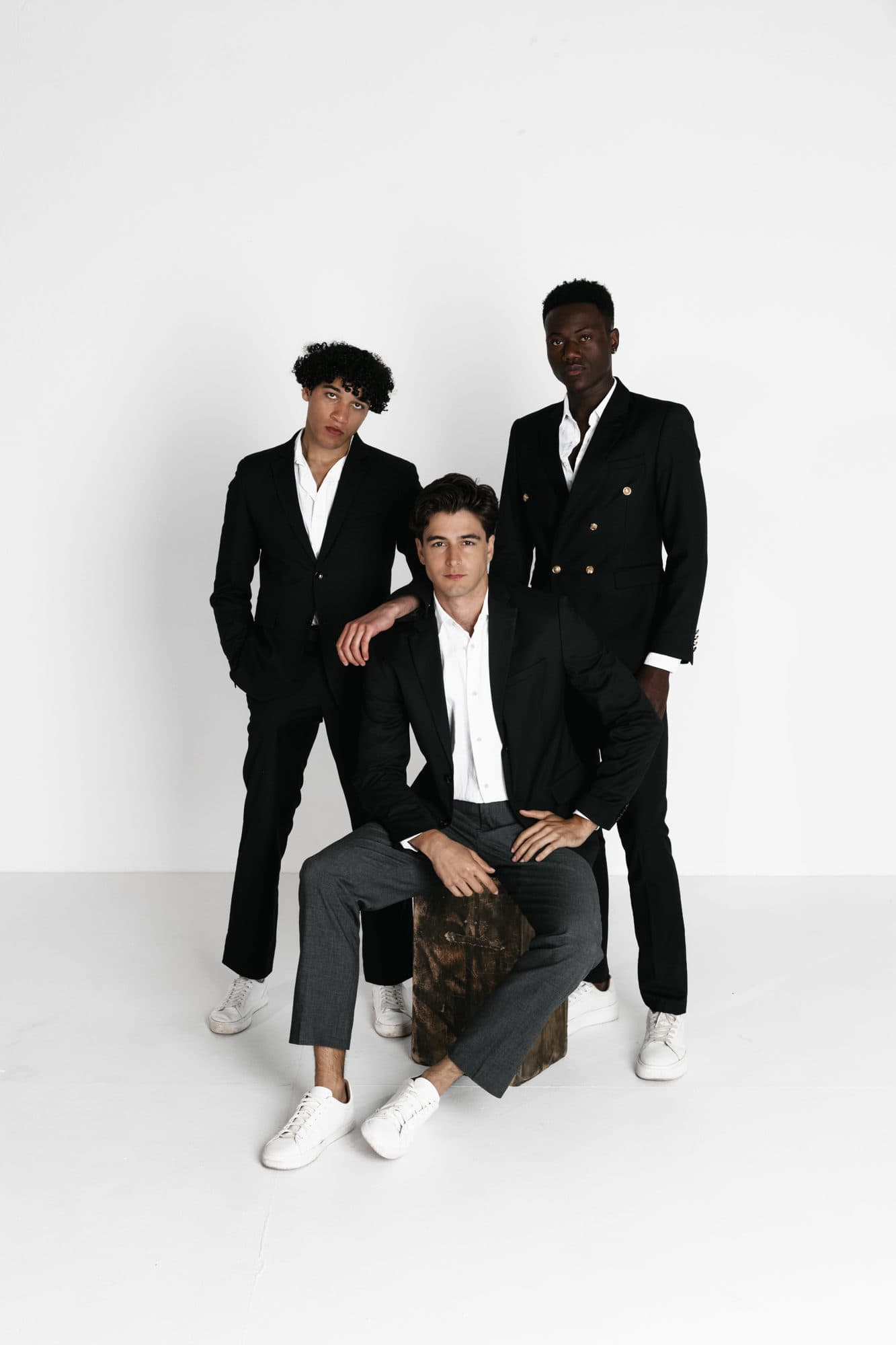 Male talent group in formal black suits