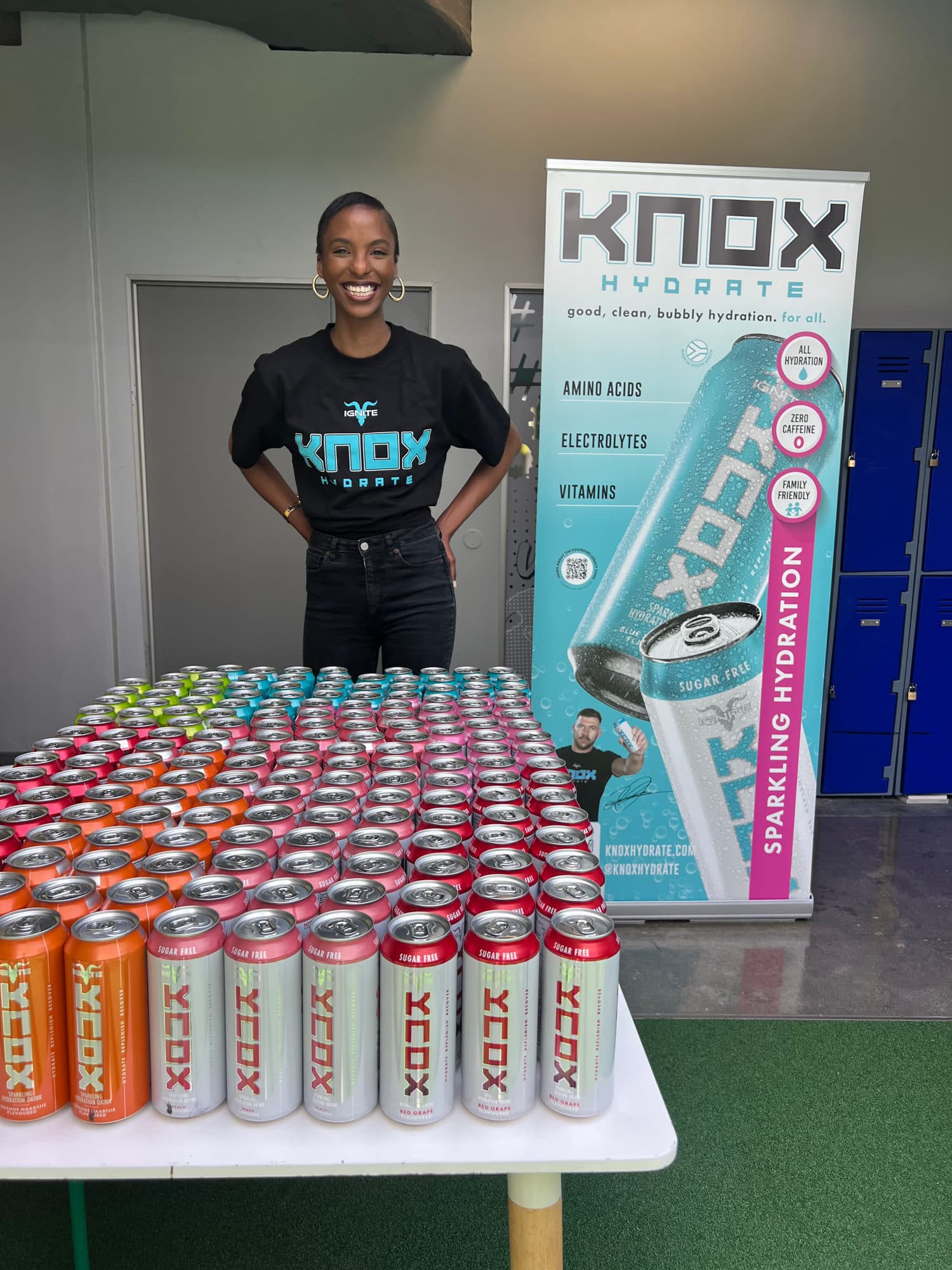 Knox Hydration ambassador at a product sampling station