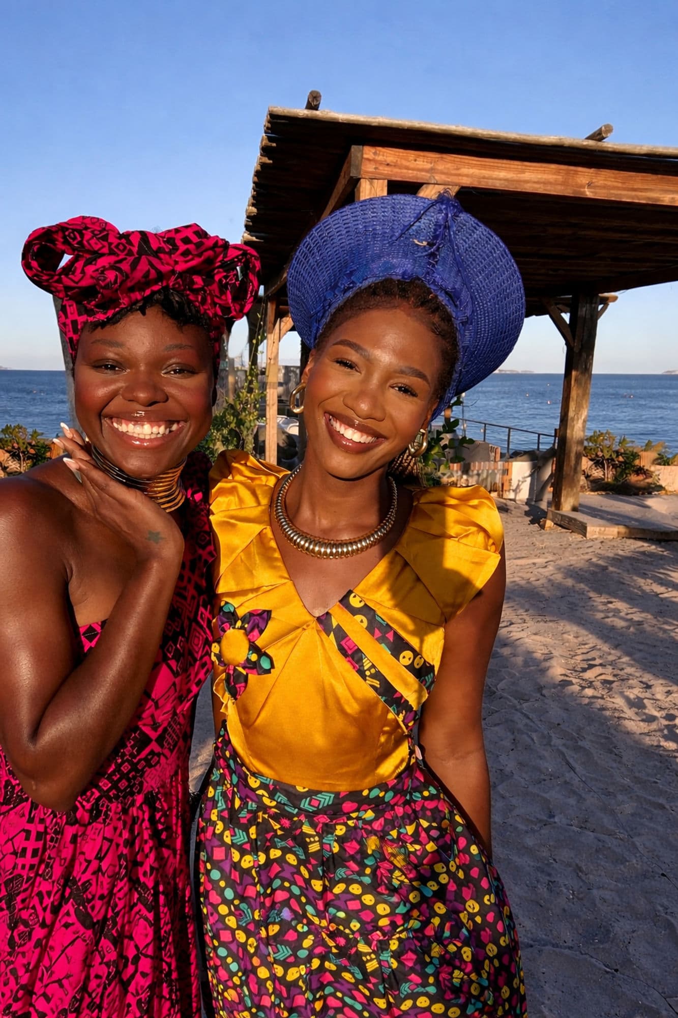Performers in colourful African outfits at a Cape Town beach venue
